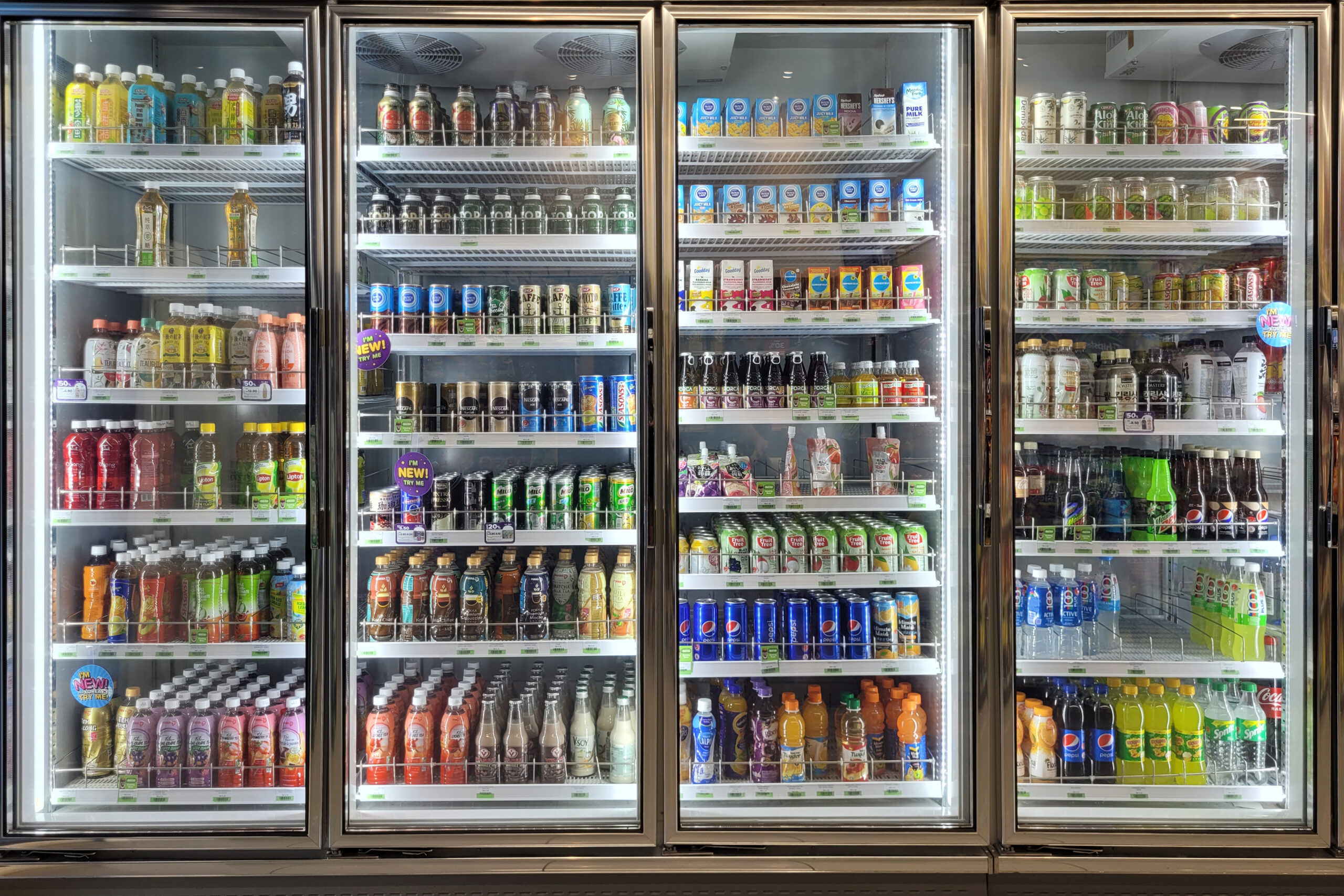 Refrigerated display of beverages showcasing diverse drink options, perfect for export to Asian markets.